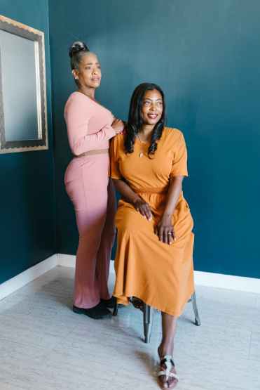 woman in yellow dress sitting on chair