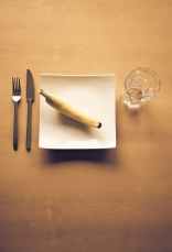 white bread on white ceramic plate beside clear drinking glass